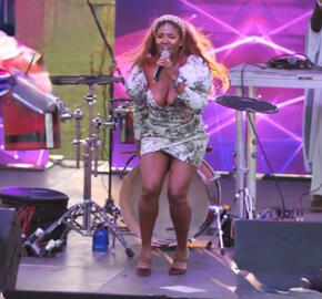 Adora Aiza dance music and soul singer live on stage with a captivated crowd Adora Aiza dance music and soul singer live on stage with a captivated crowd