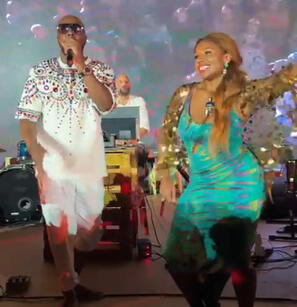 Adora Aiza on stage with international music legend Wyclef Jean for Global Citizen Forum in UAE